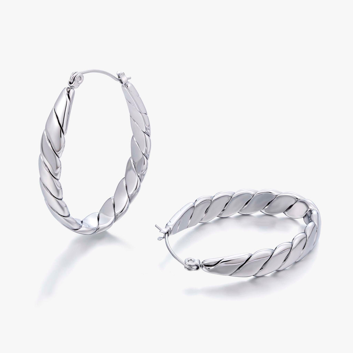 hoop earrings for women, twisted hoop earrings, chunky hoop earrings, geometric earrings, medium hoop earrings, oval earrings, sculpted earrings, textured hoop earrings, modern jewelry, fashion accessories