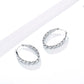 hoop earrings for women, twisted hoop earrings, chunky hoop earrings, geometric earrings, medium hoop earrings, oval earrings, sculpted earrings, textured hoop earrings, modern jewelry, fashion accessories