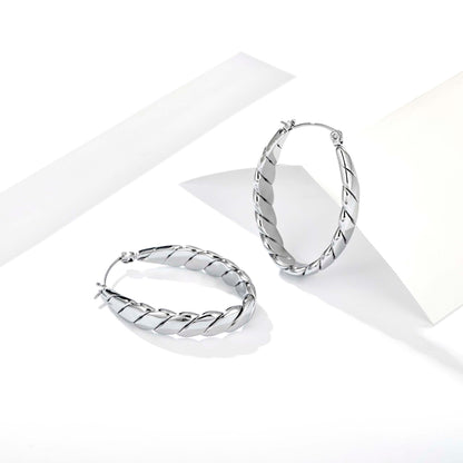 hoop earrings for women, twisted hoop earrings, chunky hoop earrings, geometric earrings, medium hoop earrings, oval earrings, sculpted earrings, textured hoop earrings, modern jewelry, fashion accessories